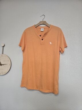 “soft faded orange vintage Abercrombie henley 🍊”